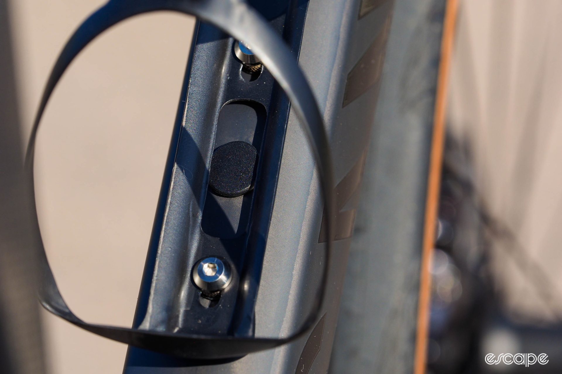 The 2024 Endurace features a nifty approach to silencing rattling lines: a zip-tie, accessible under the down tube bottle-cage mount, secures lines to keep them from banging around. 