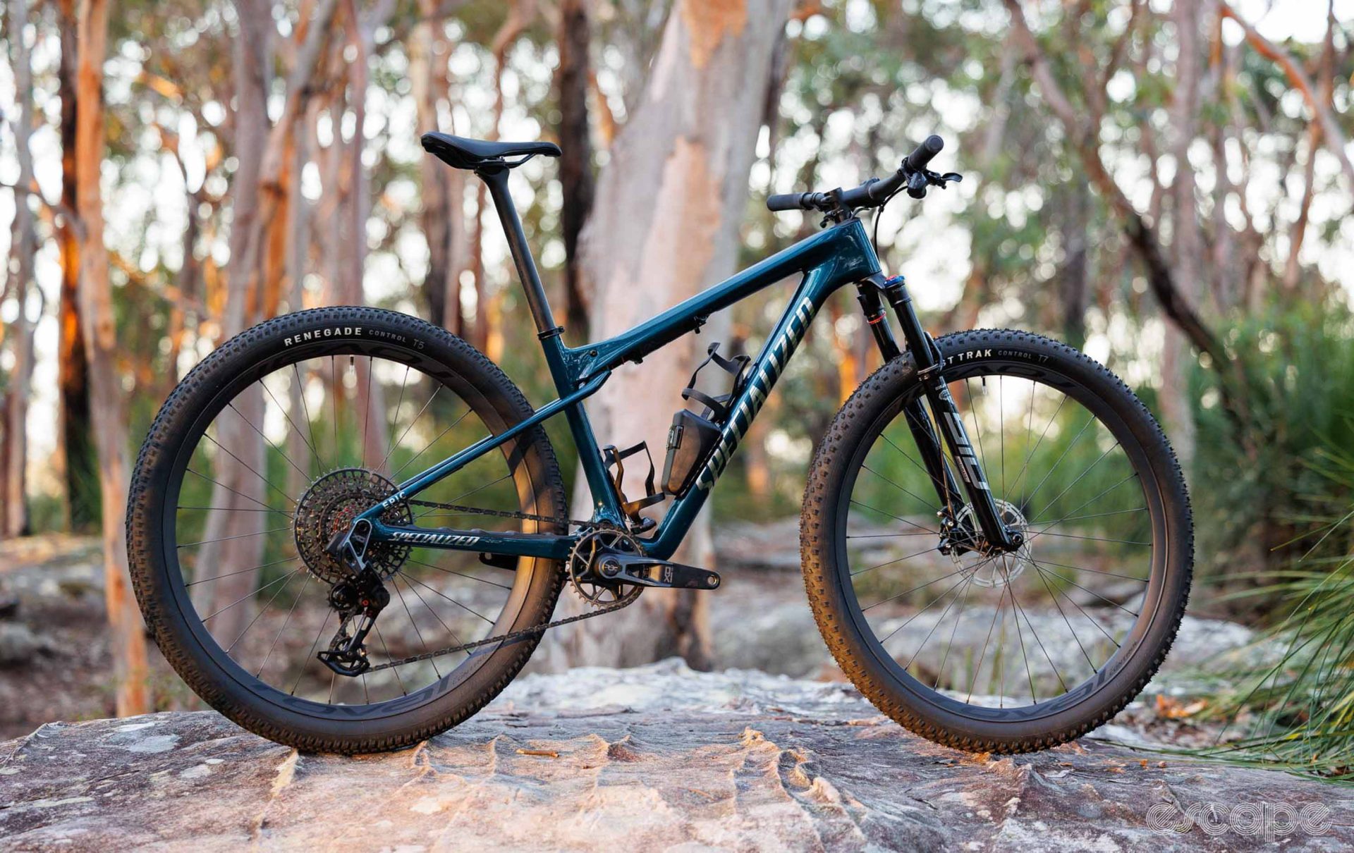 The Specialized Epic World Cup is a Supercaliber competitor and looks very similar, with a single-pivot suspension, rear shock tucked under the top tube, and similar travel This green Epic could easily be mistaken for a Supercaliber at first glance except for the large silver Specialized logo on the downtube.