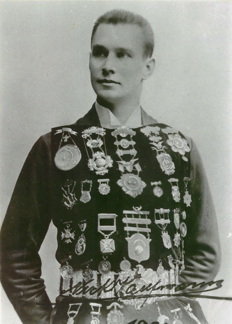 Black and white photograph of Nicholas Kaufmann, formally dressed with dozens of medals on his chest.