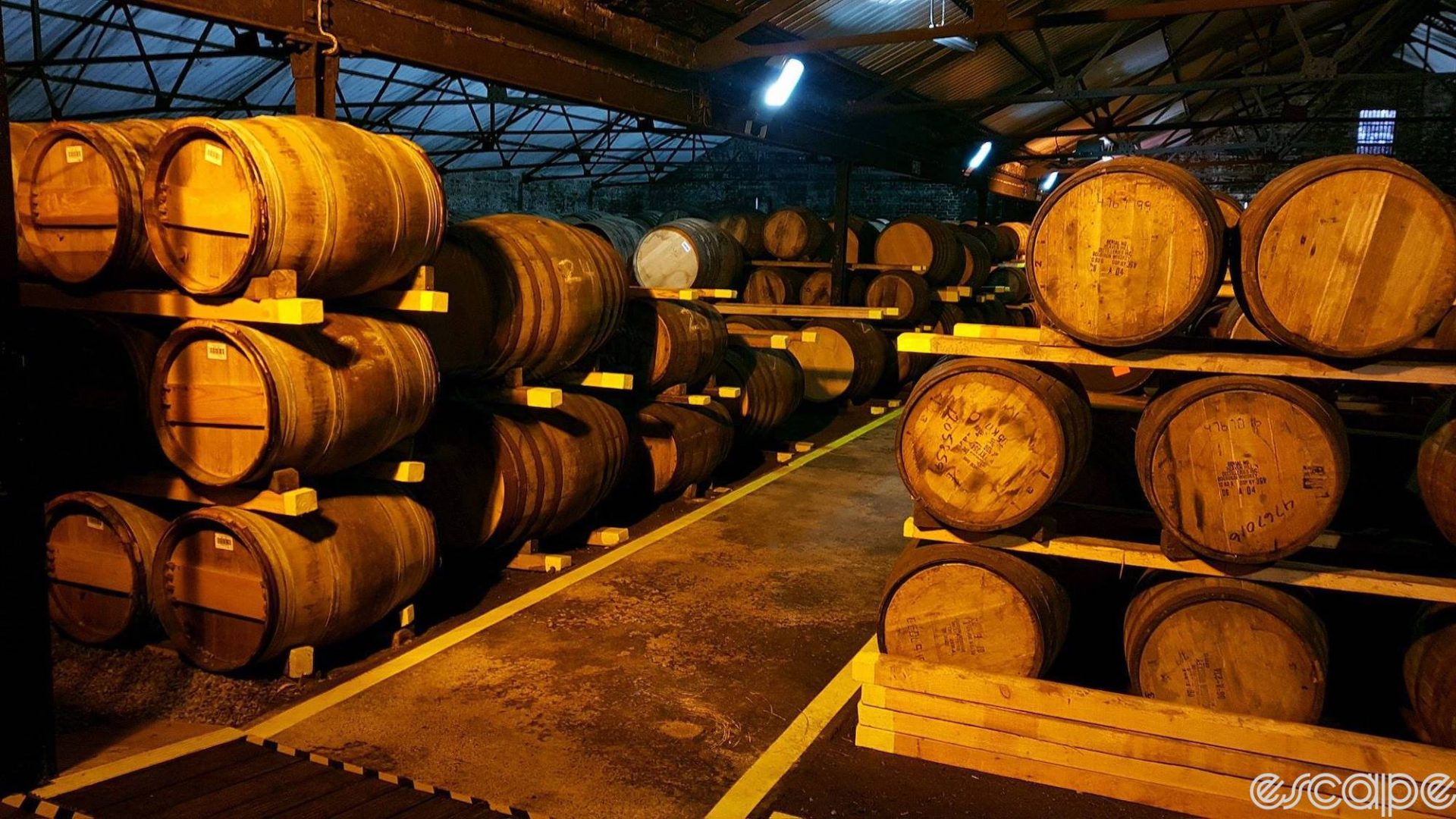 Barrels of whisky sit in a shed for aging at the Auchentoshan Distillery in Scotland.