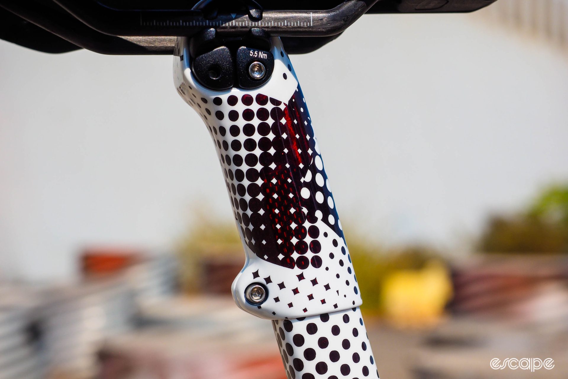 Detail shot of seatpost mast area on black and white 'digital camo' style paintjob on an Enve Custom All Road frame, showing a deep red clearcoat between the black and white pattern. 
