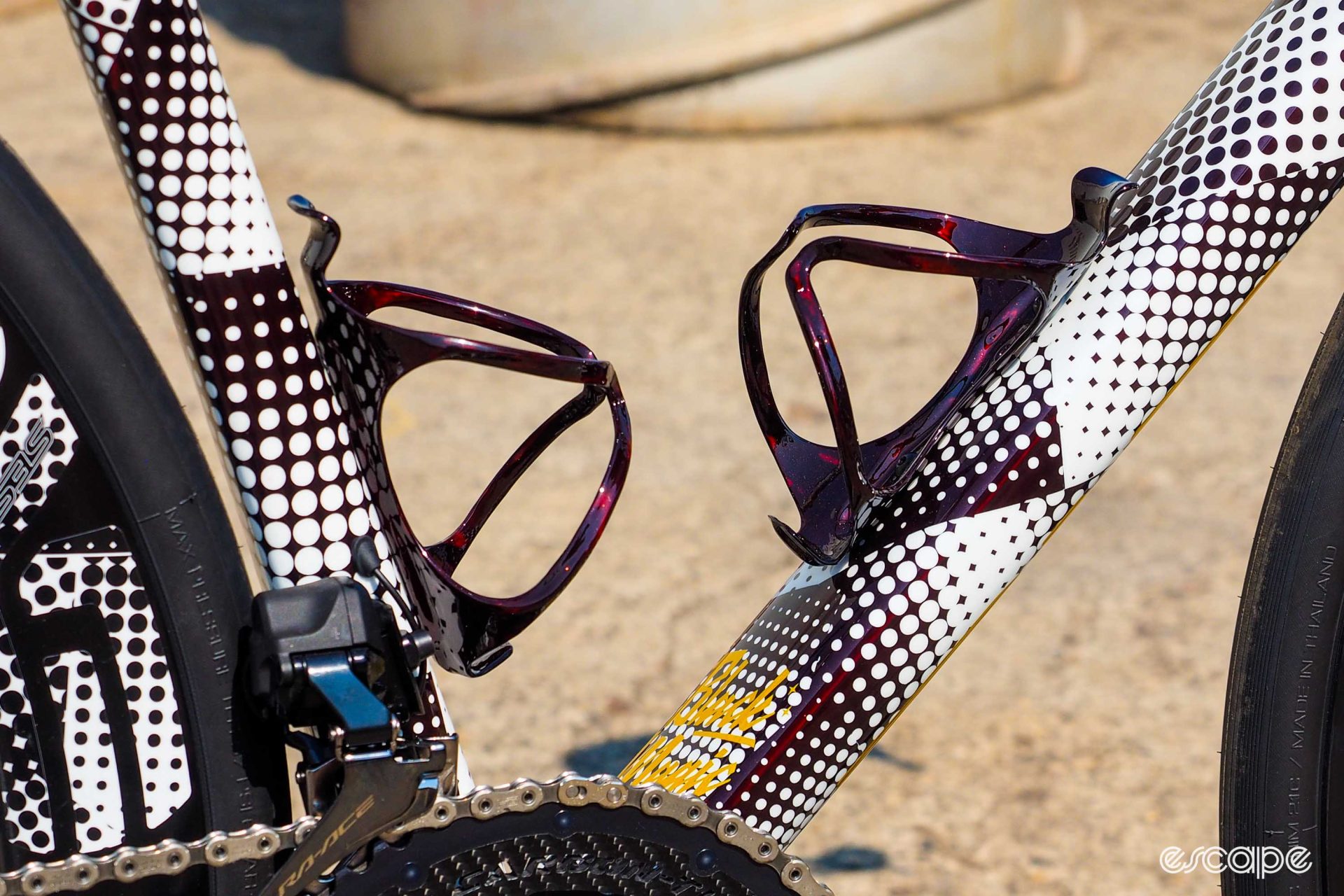 Detail shot of bottle cages, also finished with the red-tinted clearcoat (but no dots).