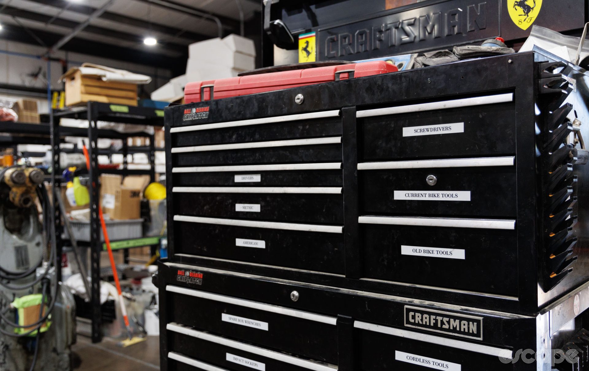 A large tool chest from Craftsman features rows of drawers labeled with various kinds of tools inside.