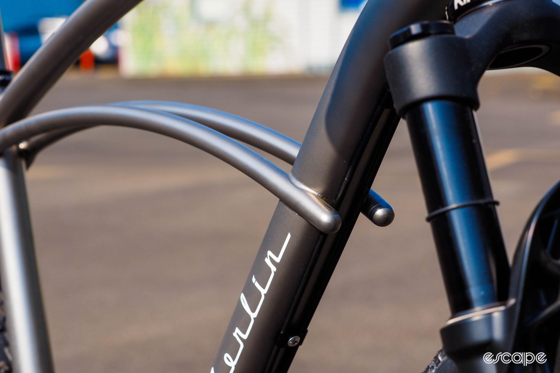Detail shot of curved seatstays meeting on the downtube.