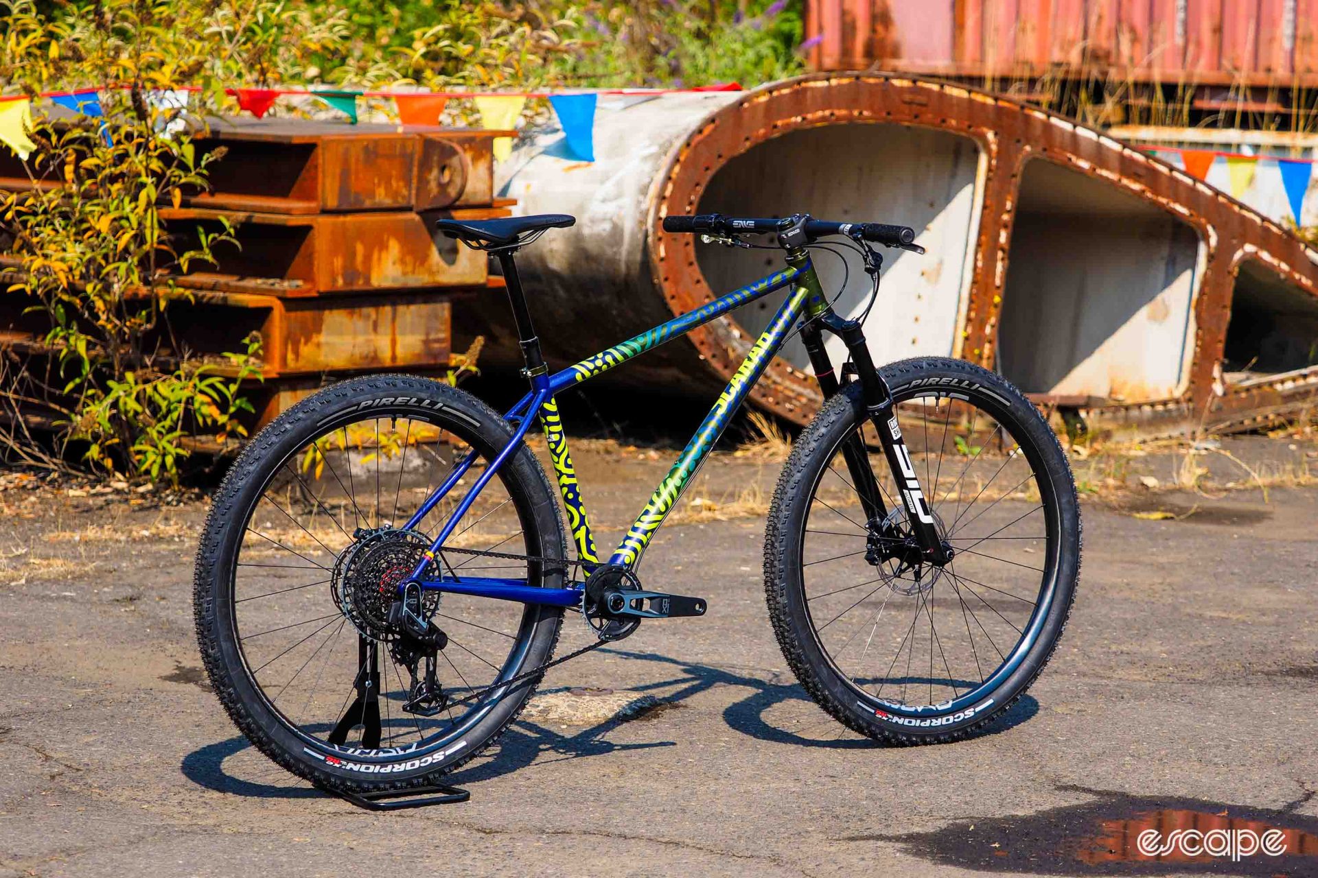 Scarab hardtail profile shot, showing an elaborate blue, green and yellow finish. 