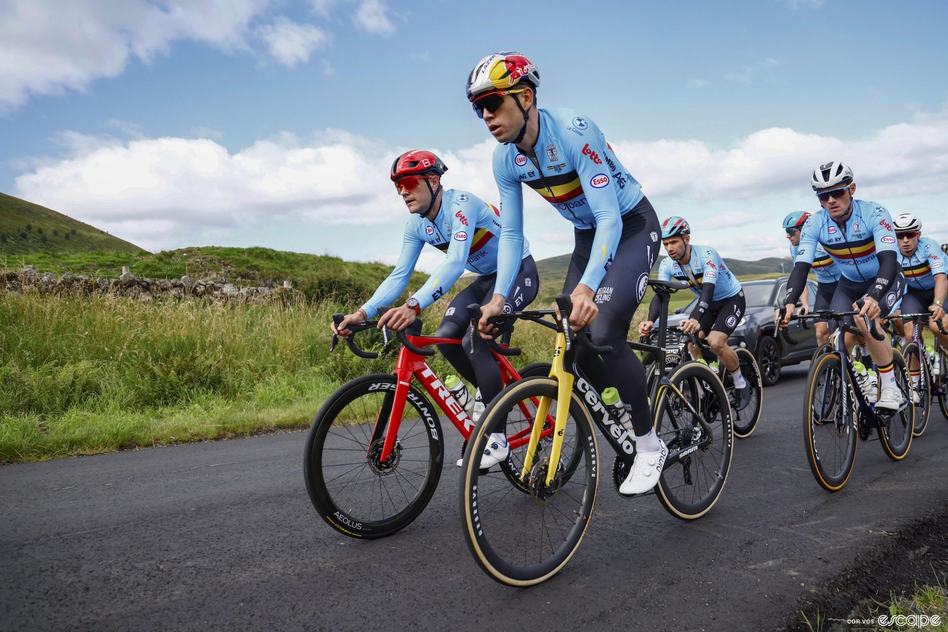 The Belgian men's road race team out for a training ride on the road course in Scotland. Wout van Aert leads, riding next to Jasper Stuyven. Victor Campanaerts and Yves Lampaerts follow behind.