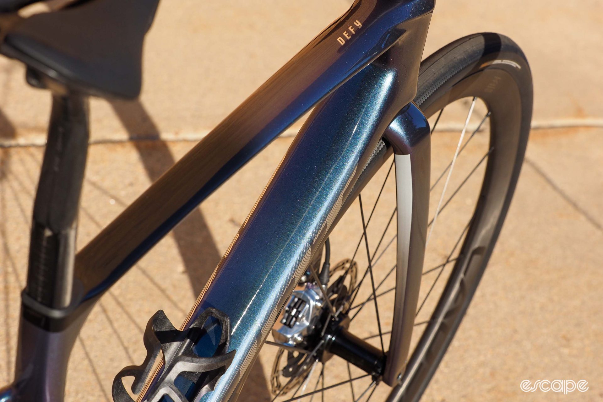 A look at the downtube of the 2024 Giant Defy Advanced, which is wide enough to almost mask a water bottle.