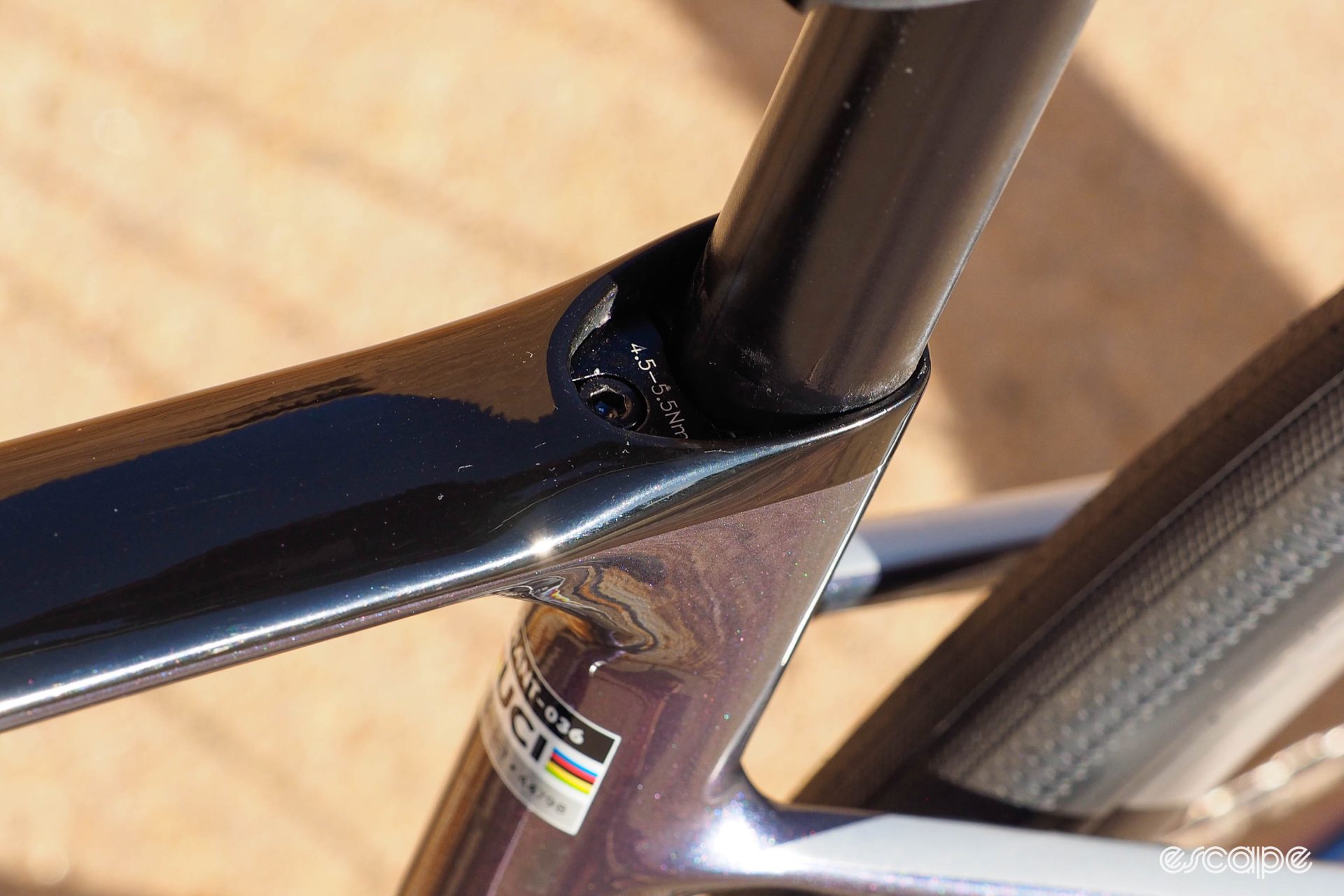 With the rubber cover removed, this view shows the seat post clamp mechanism, a wedge-style binder tucked slightly below the level of the top tube.