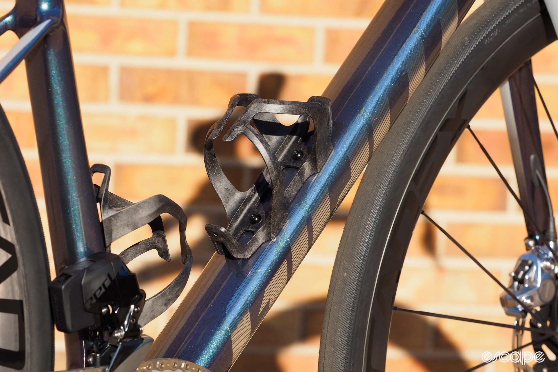 Giant includes two composite bottle cages. The cages are sculpted to fit the tubes nicely, with clean flowing lines.