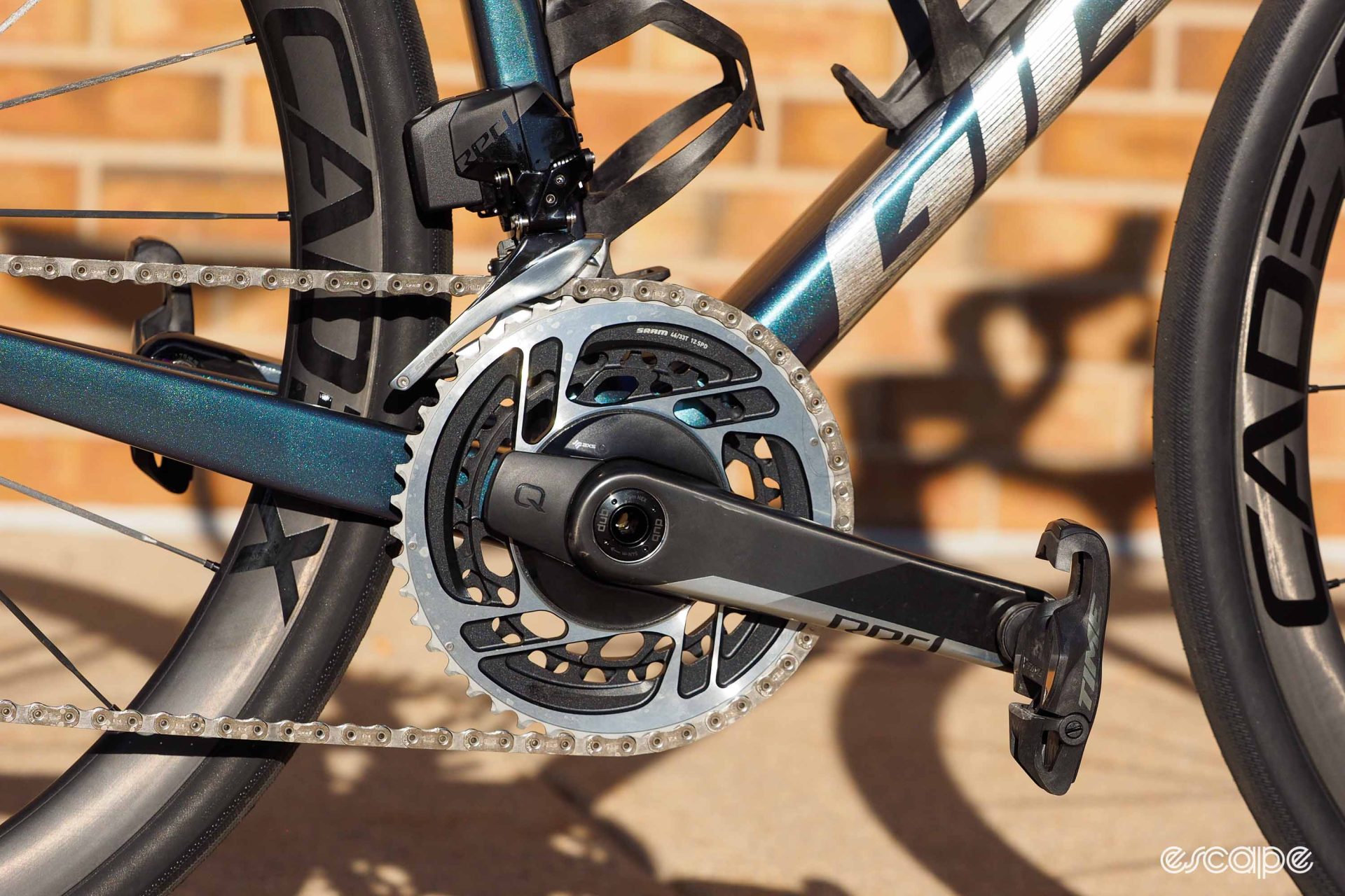 The crankset and front derailleur, which are SRAM's Red components, including a power meter crankset.