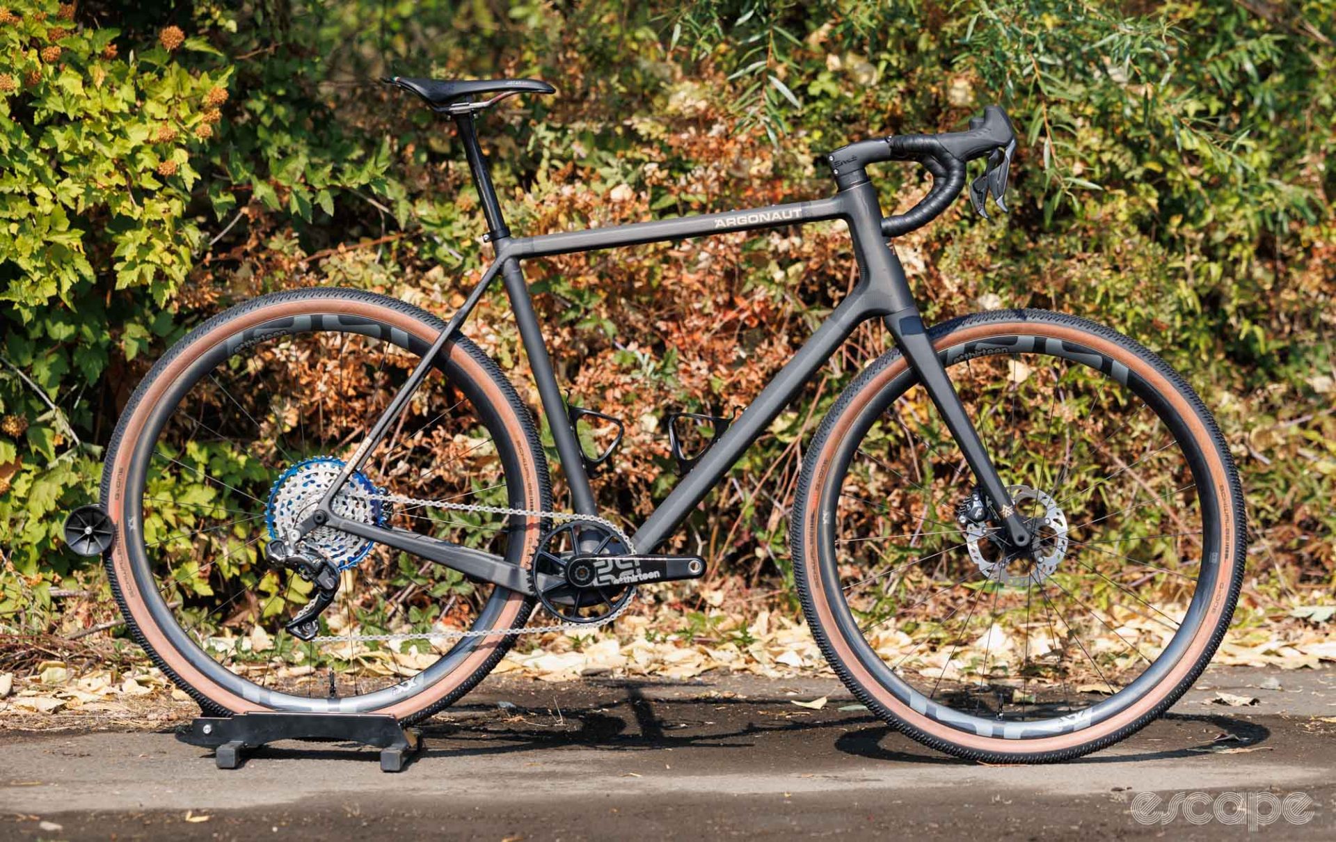 A side on view of a raw carbon fibre gravel bike from Argonaut. 