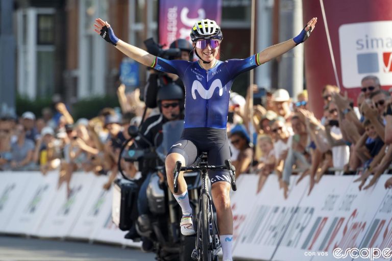 Annemiek van Vleuten crosses the finish line of the Simac Ladies Classic final stage. She is alone, arms raised in the air to acknowledge the crowds gathered for her last race.