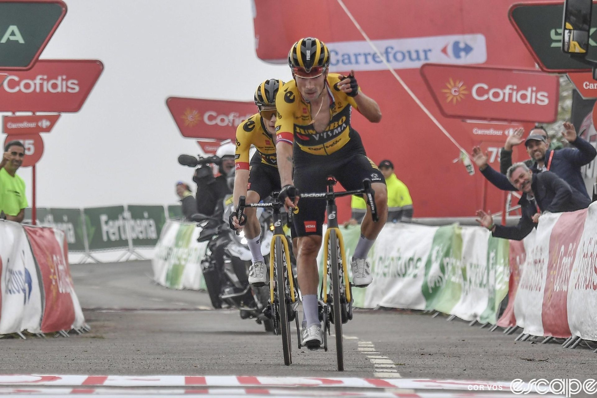 Primož Roglič leads teammate Jonas Vingegaard across the line to win stage 17 of the 2023 Vuelta a España. Both look shelled.