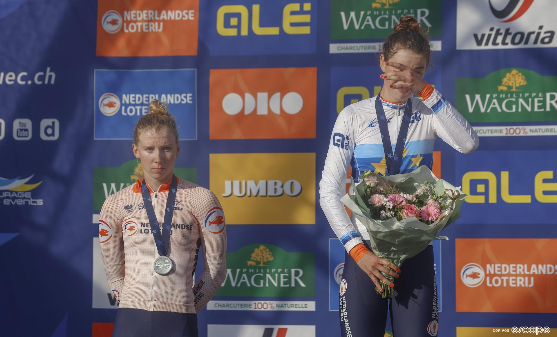 Mischa Bredewold in tears in her new European Champion jersey next to a very stoic Lorena Wiebes in second.