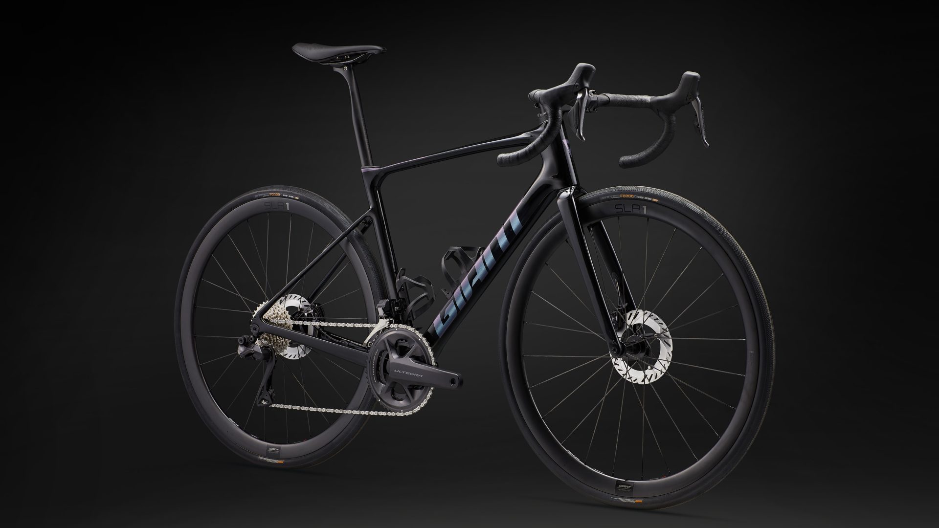 The 2024 Giant Defy Advanced Pro 0 in front-quarter profile, with black paint and silvery blue decals.