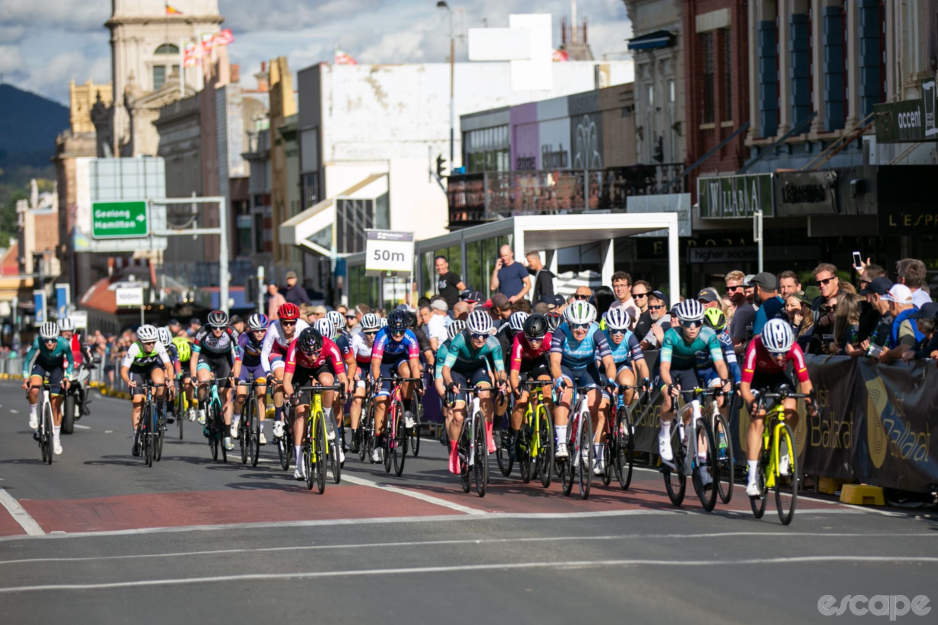 A peloton of cyclists races up Sturt Street in Ballarat.