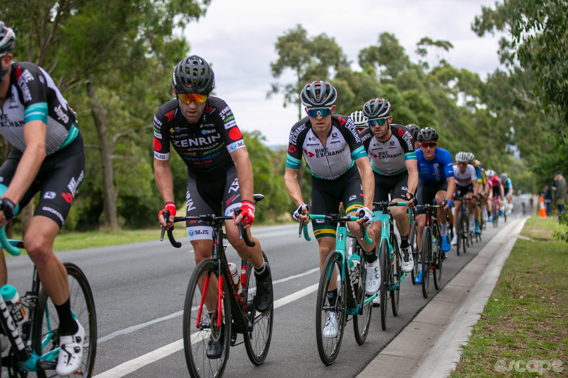 A group of cyclists rides up the Mt. Buninyong climb in single file.