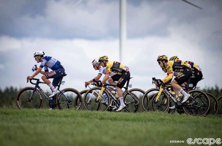 A group of riders at the 2023 Liege-Bastogne-Liege, comprised of Soudal Quick-Step and Jumbo-Visma racers only. Remco Evenepoel can be seen just behind a Jumbo rider.