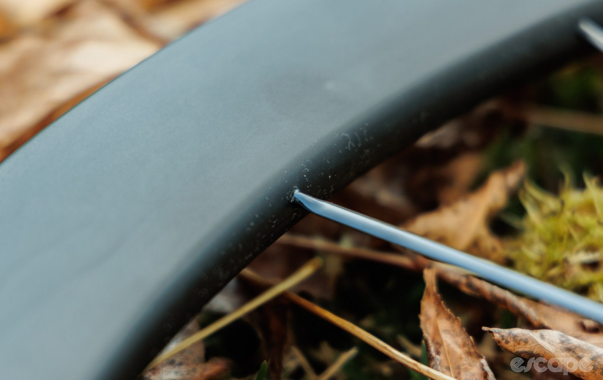 A closeup of the spoke and rim connection; the spokes are bonded to the rim, with no nipple to adjust tension or offer easy replacement options.