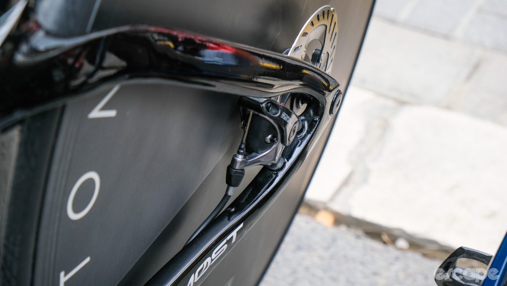 The image shows a mechanical disc brake calliper on the rear of Omar Fraile's TT bike.