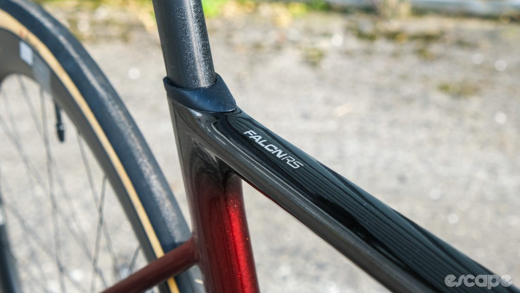 The top tube and seatpost-clamp area of the Falcn RS, with a cover for the clamp mechanism.
