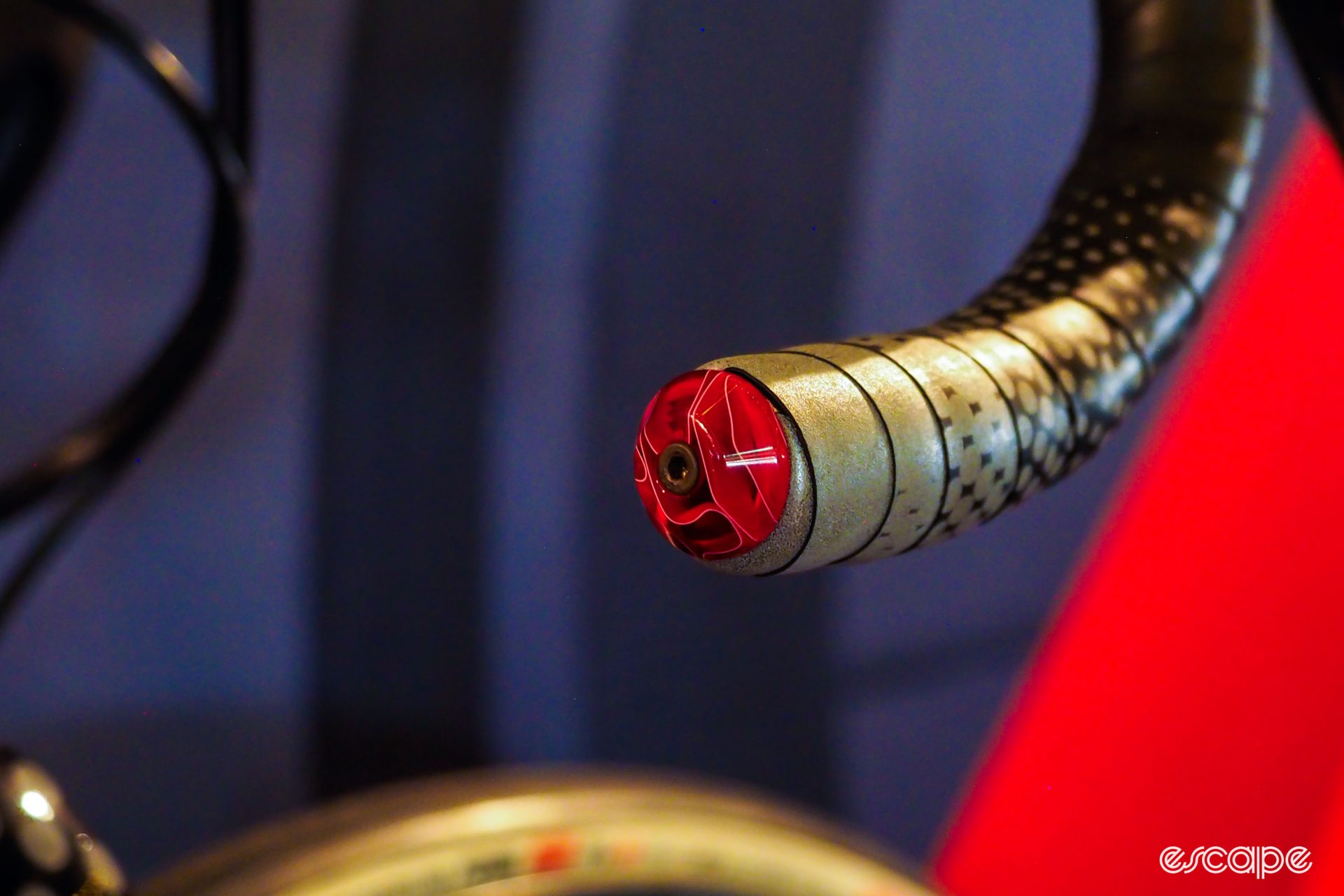Red translucent custom bar end plug from Handlebar Cyclery.