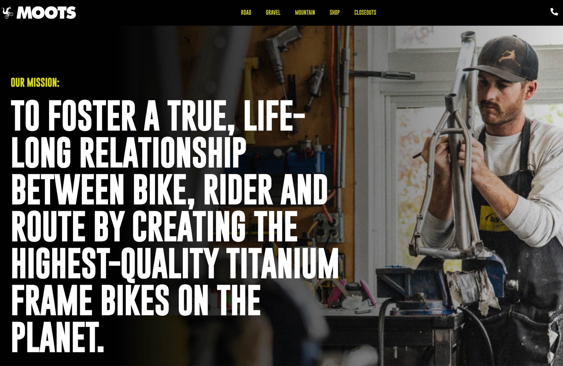 Screengrab from the Moots web site with a photo of a worker and frame on the factory floor. The large-print marketing copy reads "Our Mission: To foster a true, life-long relationship between bike, rider and route by creating the highest-quality titanium bike frames on the planet."