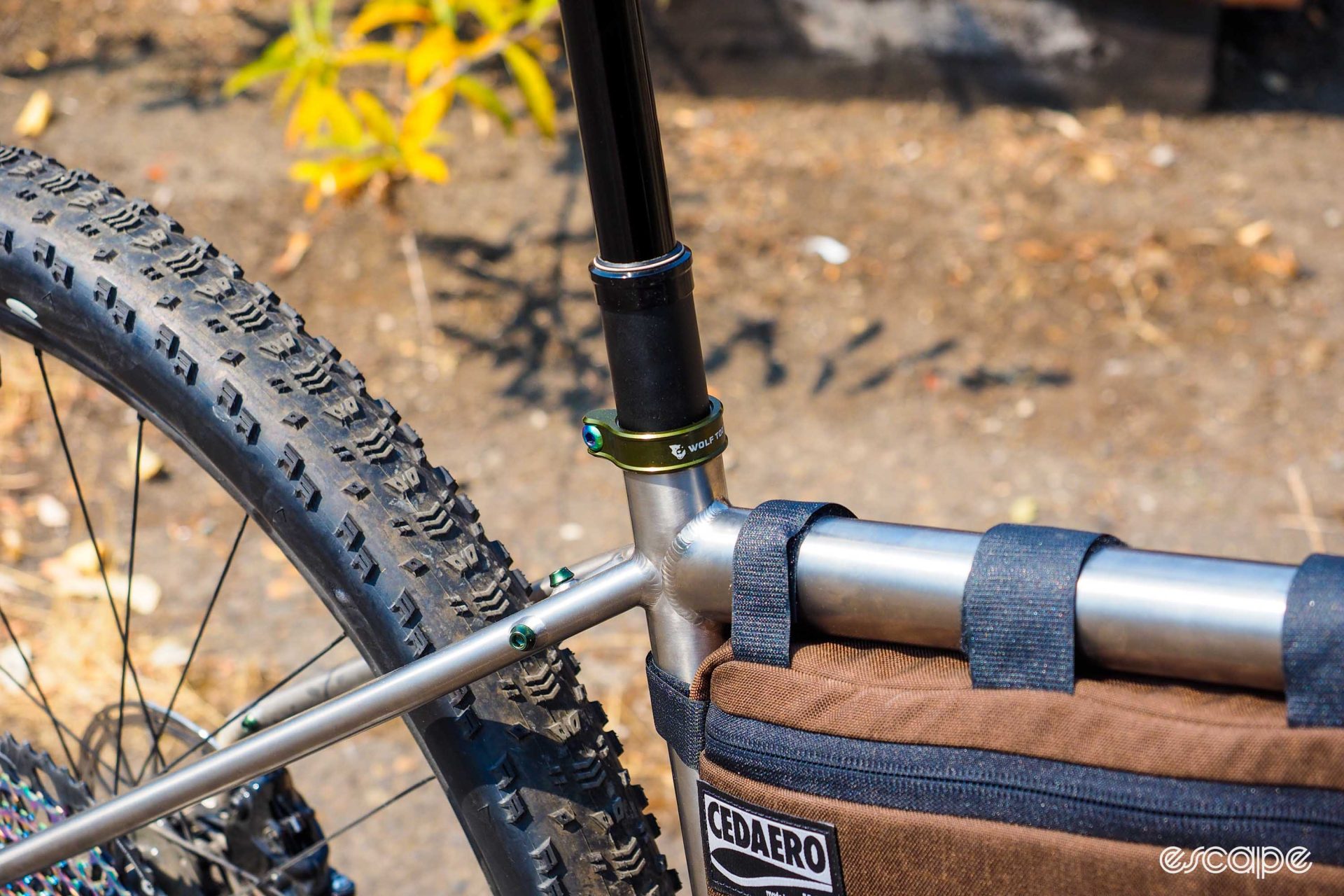 Olive green anodized Wolf Tooth Components seatpost collar on an Otso Warakin Ti.