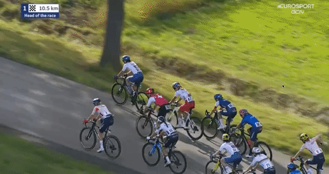 Mischa Bredewold sneaks through the remaining peloton and accelerates off the front. 