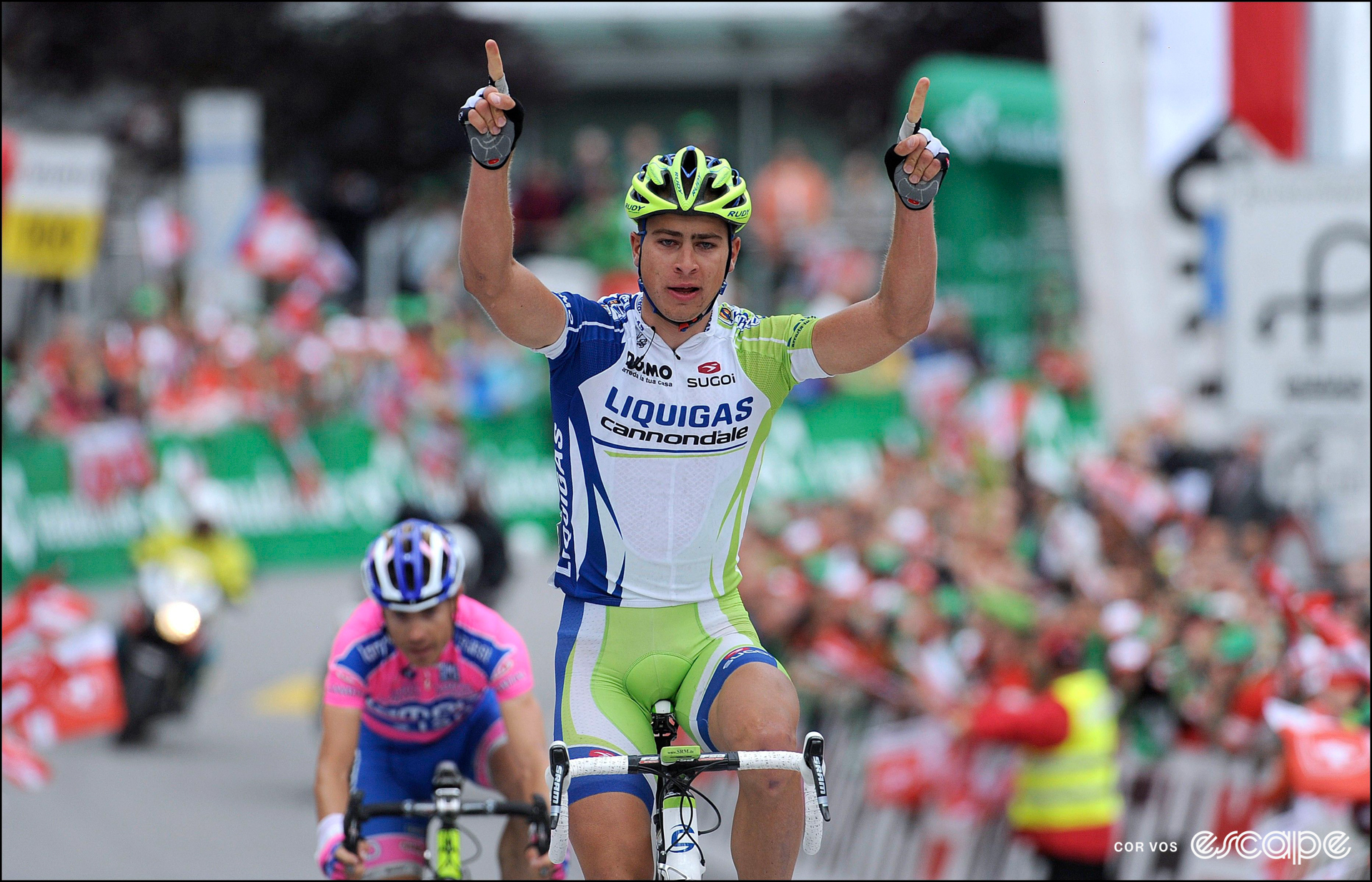 Peter Sagan celebrates winning a stage at the 2011 Tour de Suisse, with two index fingers pointing upward.