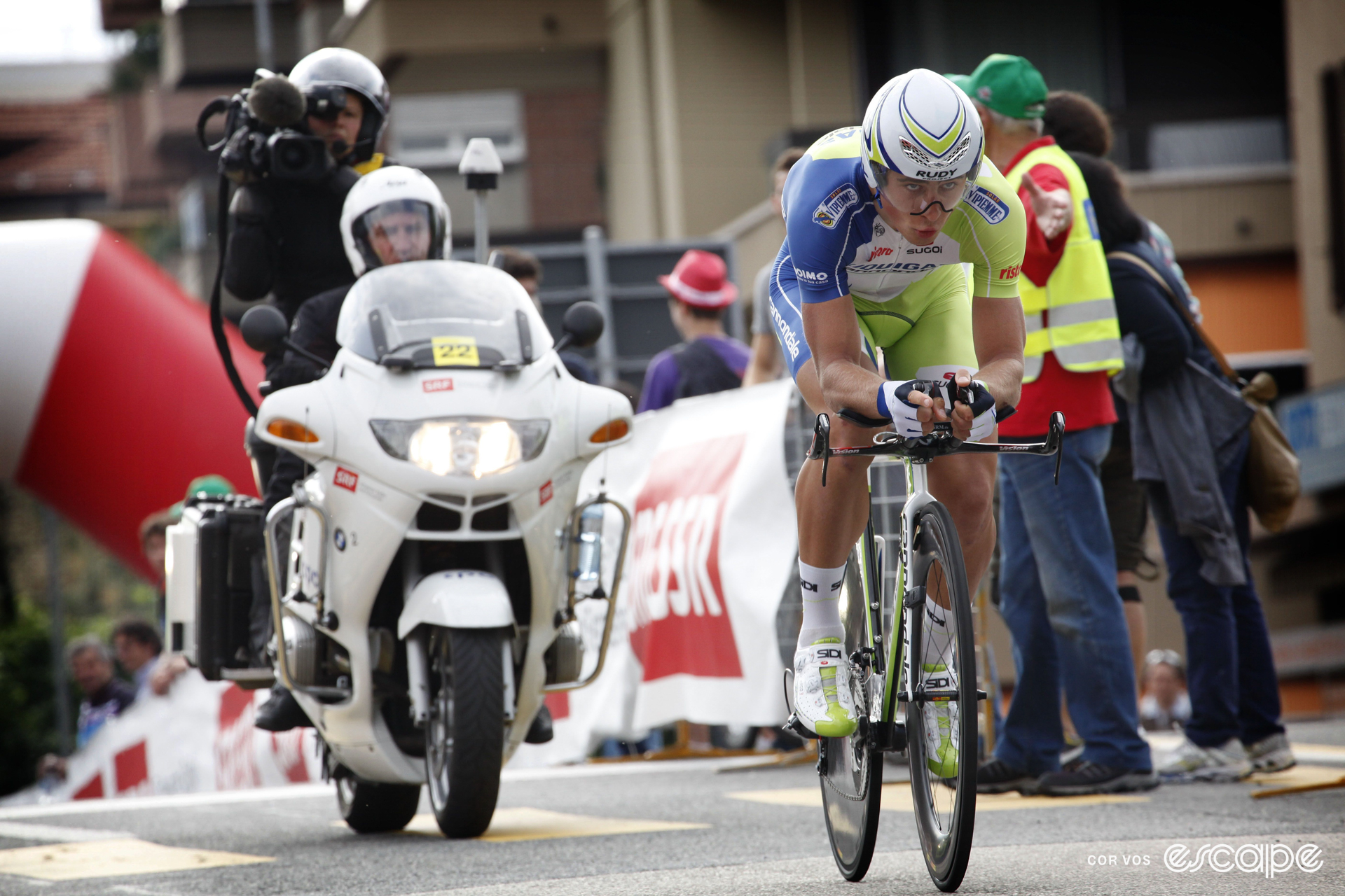Peter Sagan on his time trial bike, wearing an aero helmet, looking ahead with determination.