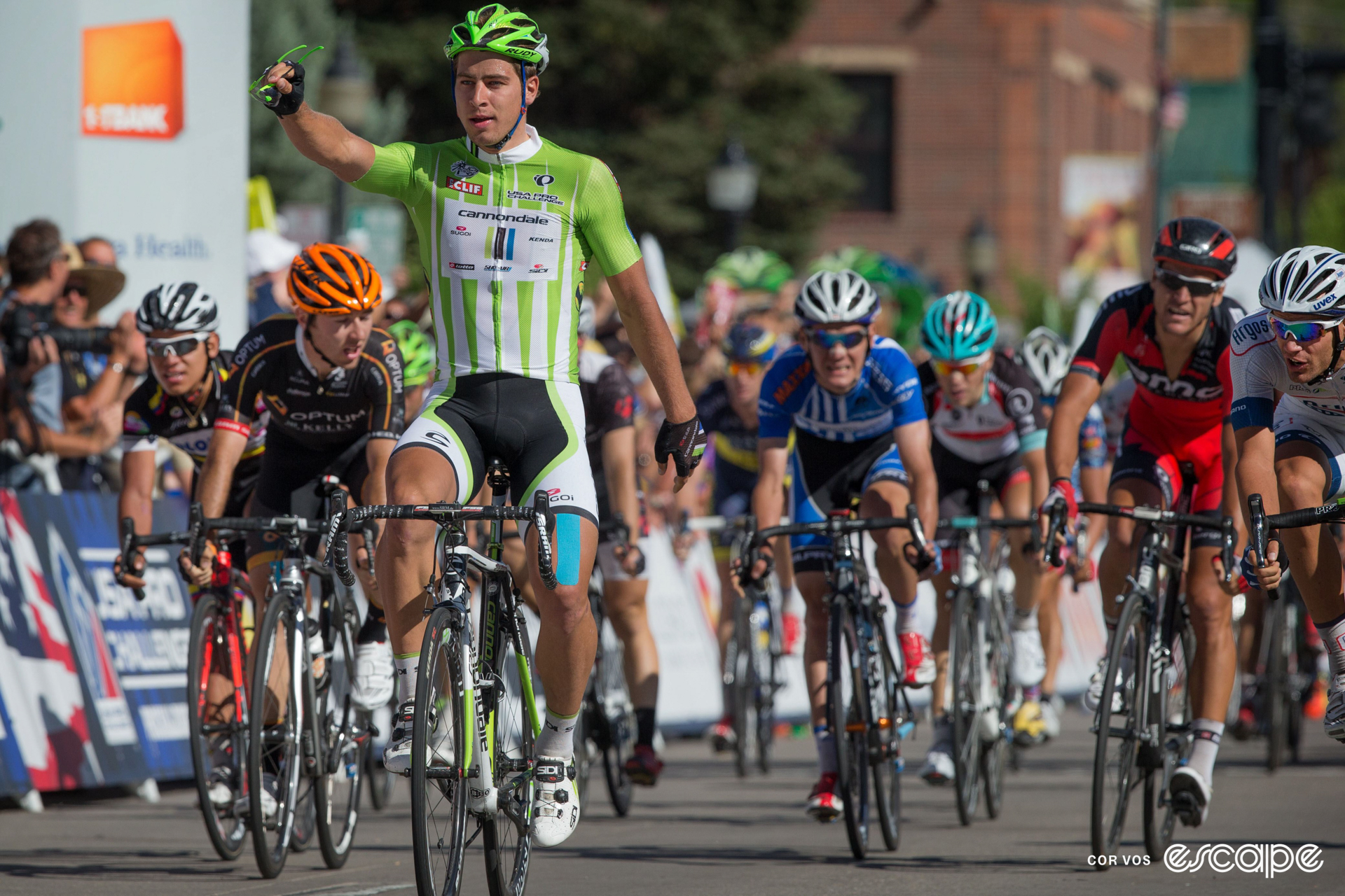 Peter Sagan celebrates winning a stage at the 2013 USA Pro Challenge, taking his sunglasses off in the process.
