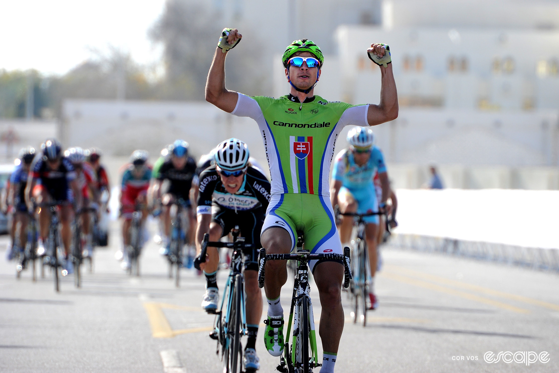 Peter Sagan celebrates winning a stage at the 2014 Tour of Oman with a double overhead fist-pump.