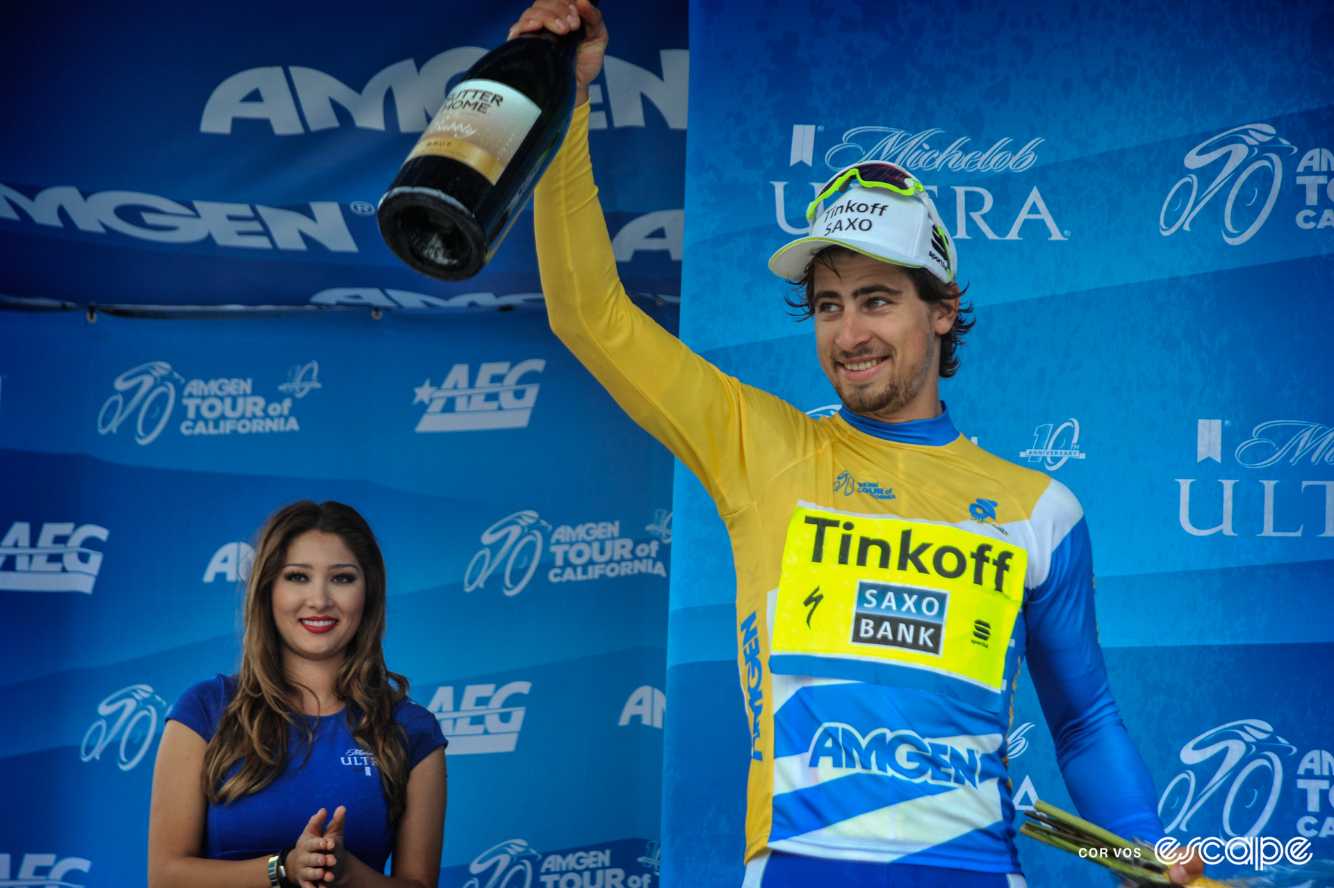 Peter Sagan celebrates winning the 2015 Tour of California, celebrating on the final podium with a fist pump.