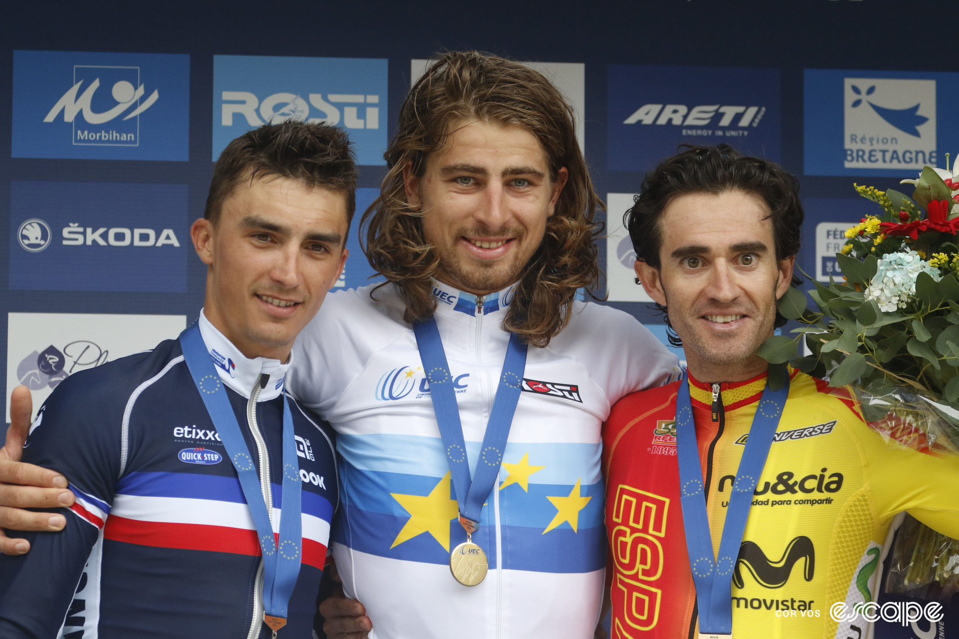 Peter Sagan on the podium at the 2016 European road championships, wearing the blue and white continental champion's jersey and a gold medal, flanked by Julian Alaphilippe and Dani Moreno.