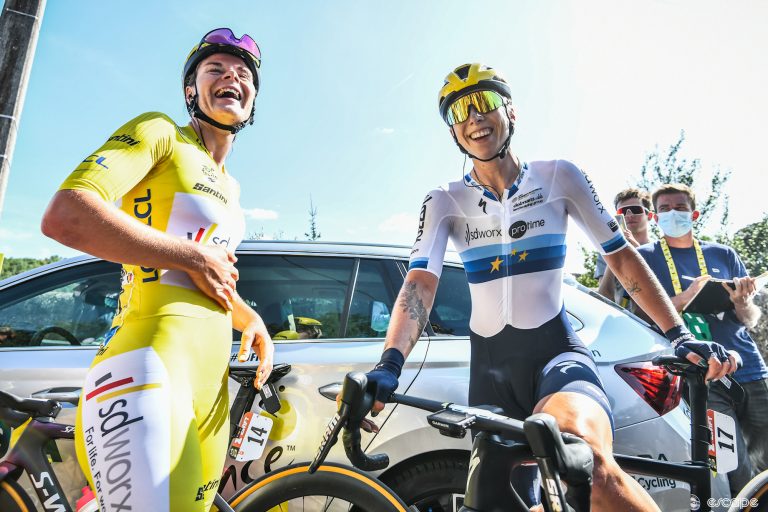 Lotte Kopecky in the yellow leaders jersey and European Champion Lorena Wiebes laugh at something before the third stage of the 2023 Tour de France Femmes avec Zwift.
