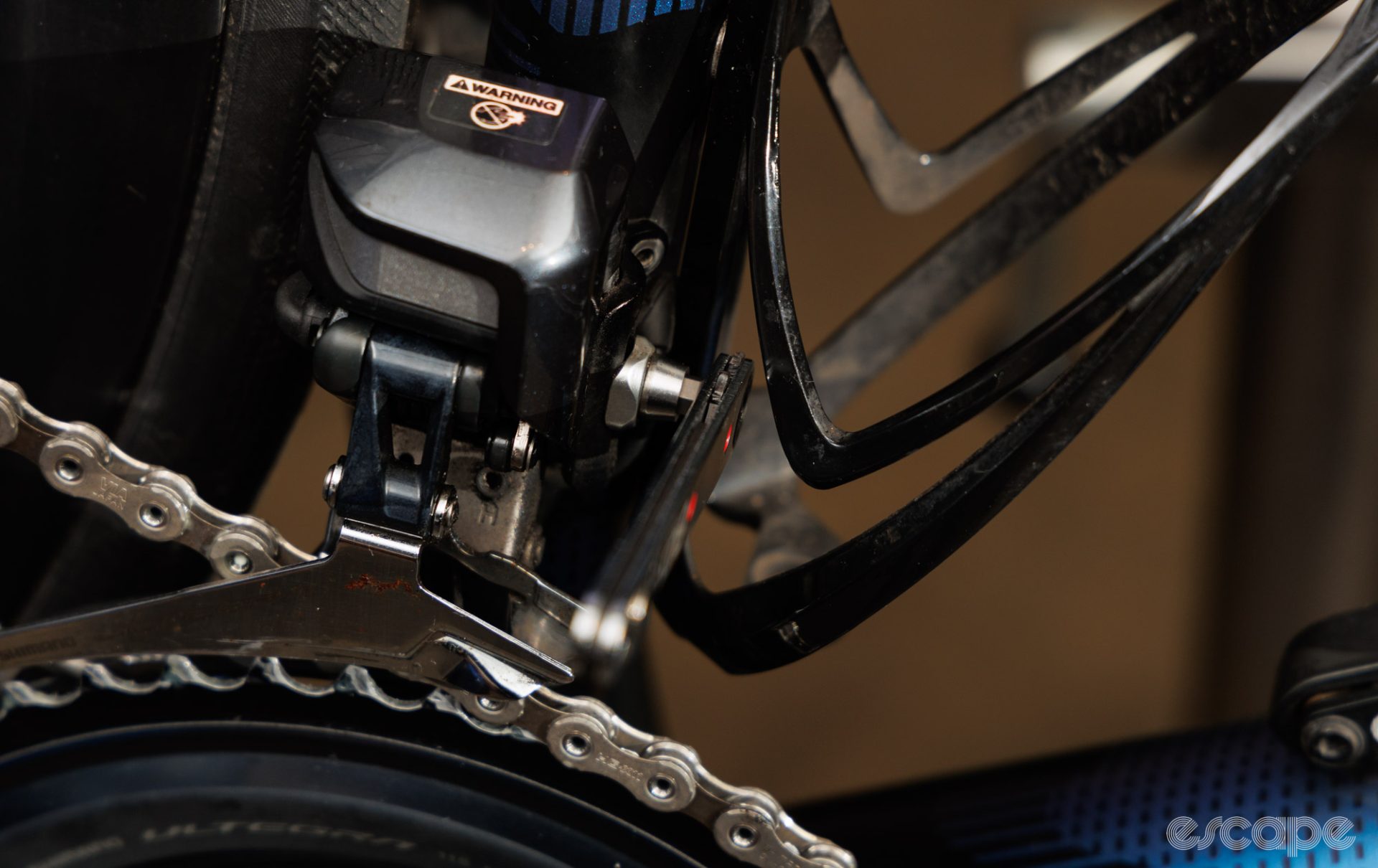 A low profile ratchet squeezed into the tight gap between a front derailleur mount bolt and a bottle cage. 