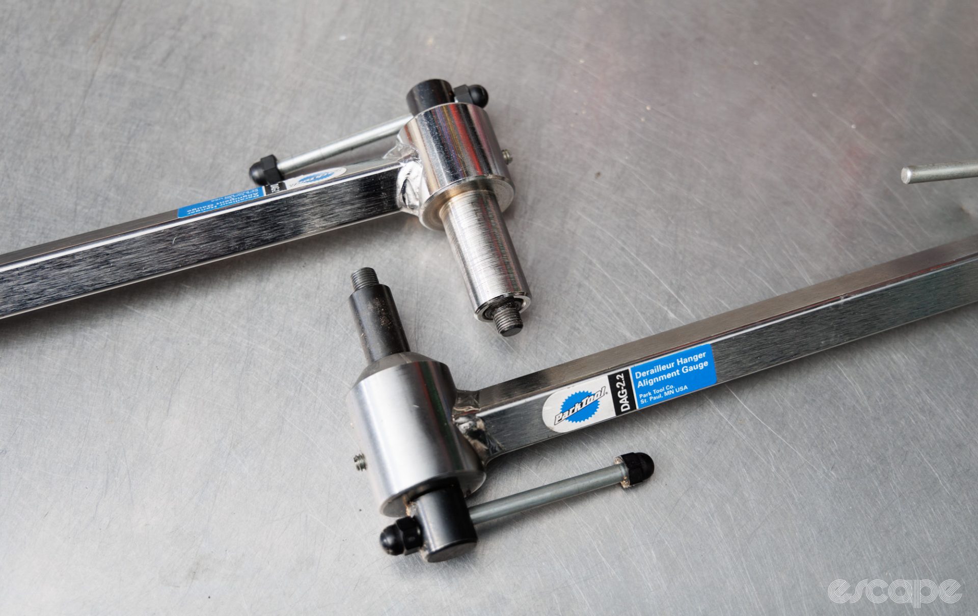 Park Tool DAG-2 and DAG-2.2 derailleur hanger tools aligned to each other on a bench. 