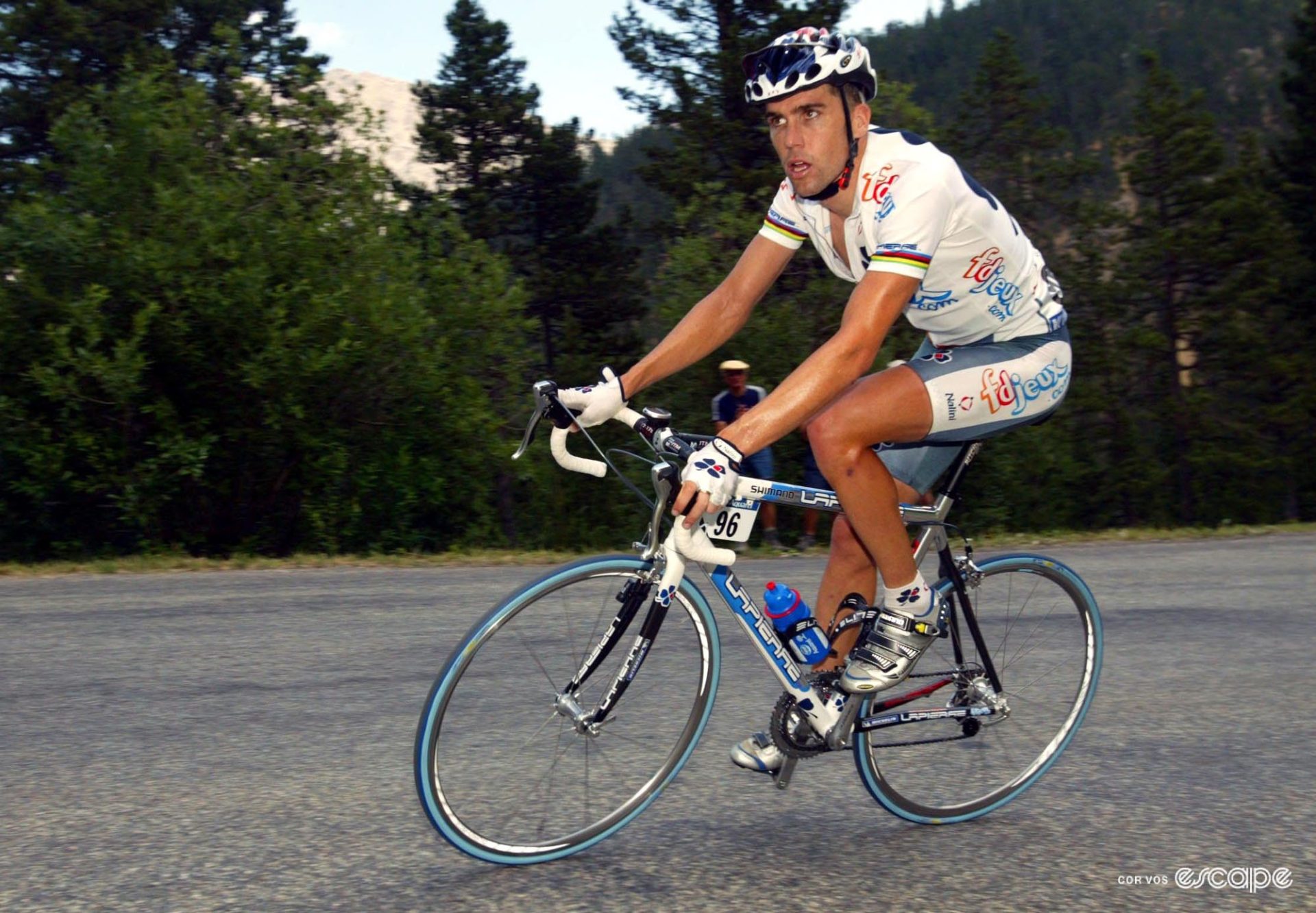 Bradley McGee rides a metal bike up a mountain.