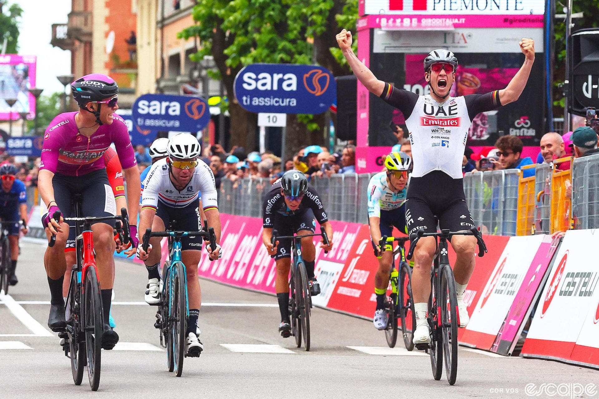Pascal Ackermann wins stage 11 of the 2023 Giro d'Italia over Jonathan Milan, left, in the Ciclamino jersey and British champion Mark Cavendish, center.