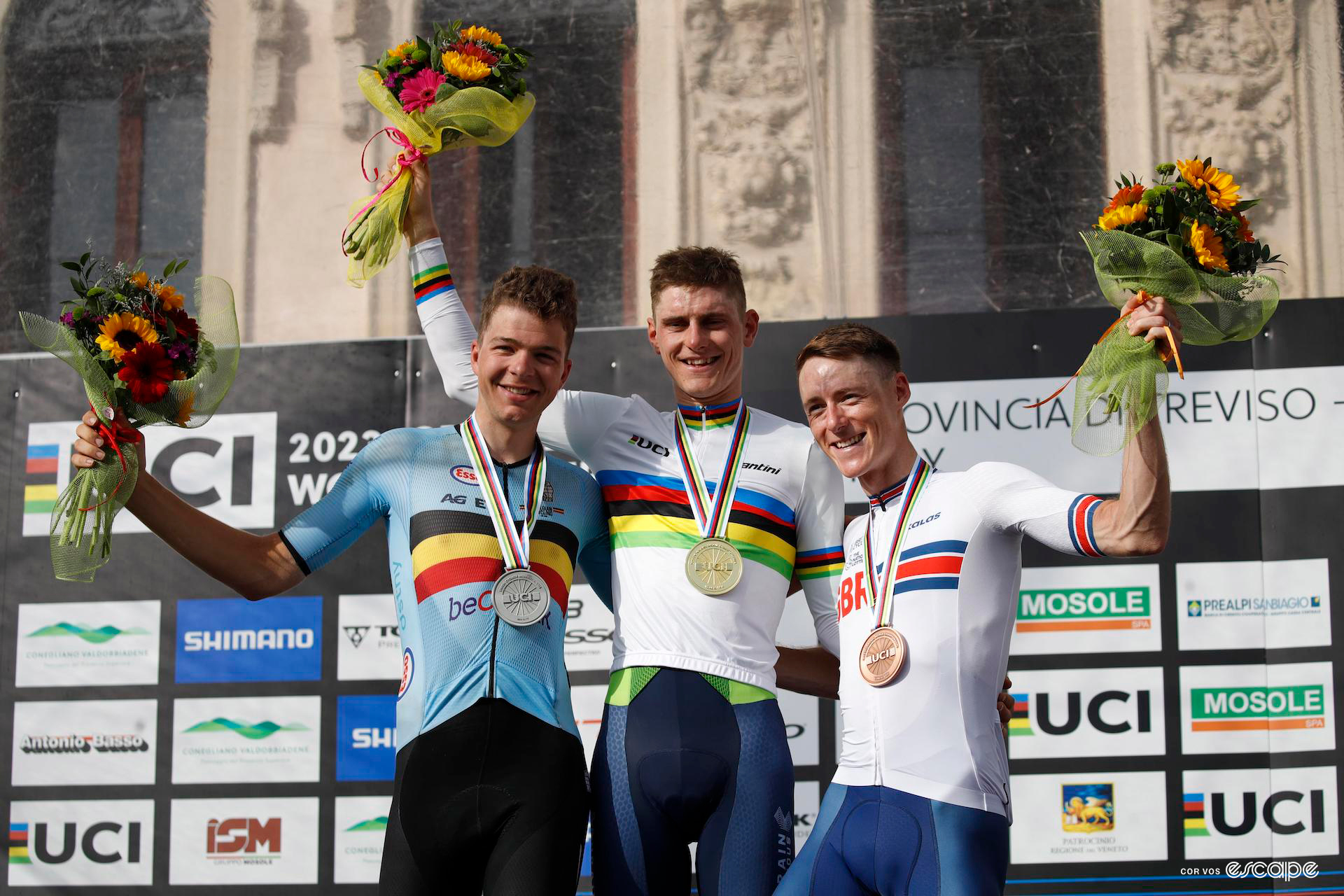 From left to right, second-place Florian Vermeersch, winner Matej Mohorič, and third-place Connor Swift on the podium of the 2023 gravel world championship men's race.