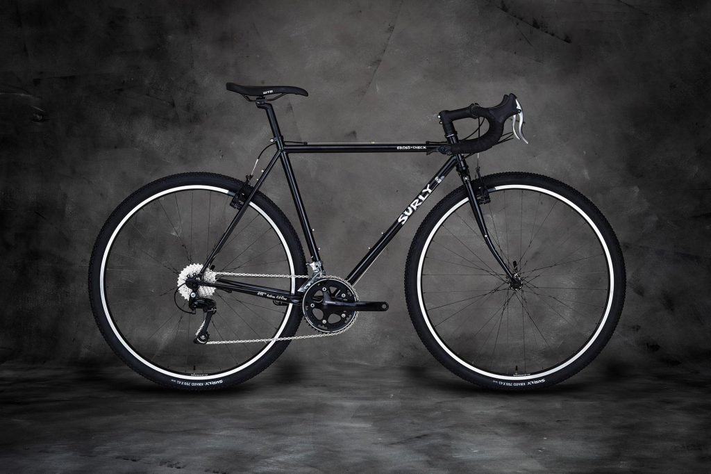 Studio shot of a black Surly Cross-Check in profile.