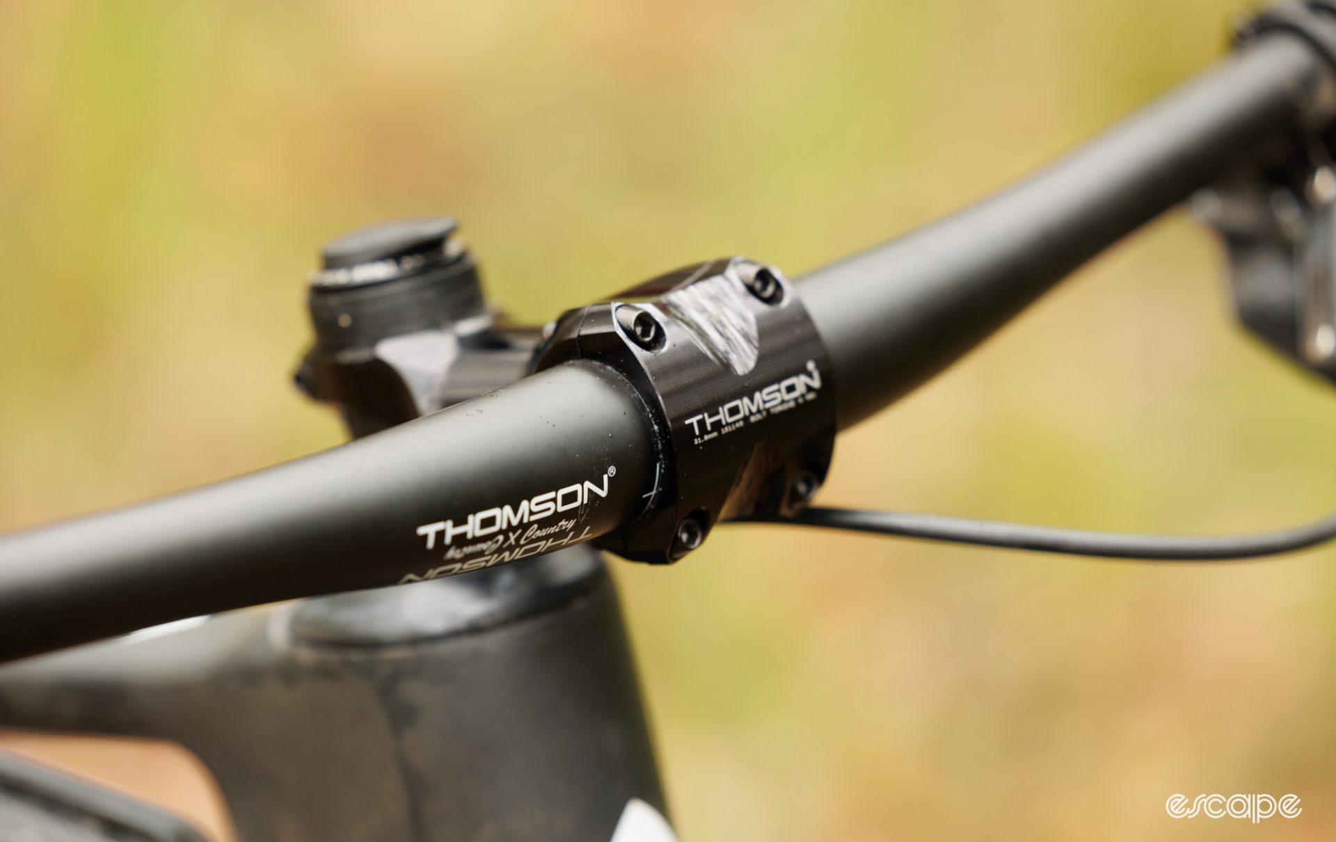 A Thomson stem and carbon handlebar with the stem bolts replaced. 