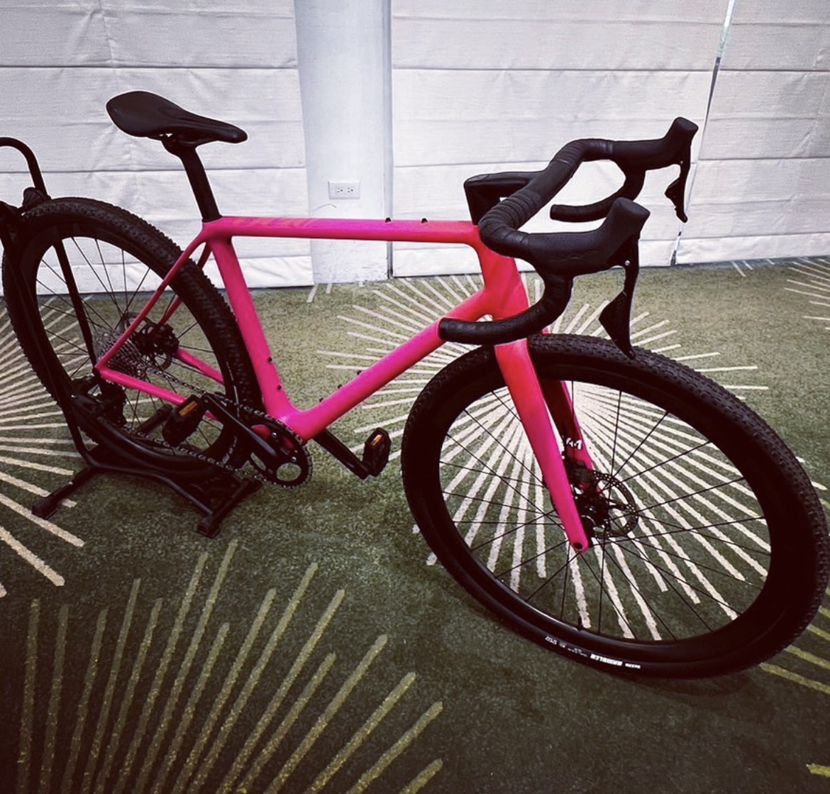 The photo shows a view of the new Classified and TRP-developed electronic groupset on a pink gravel bike.