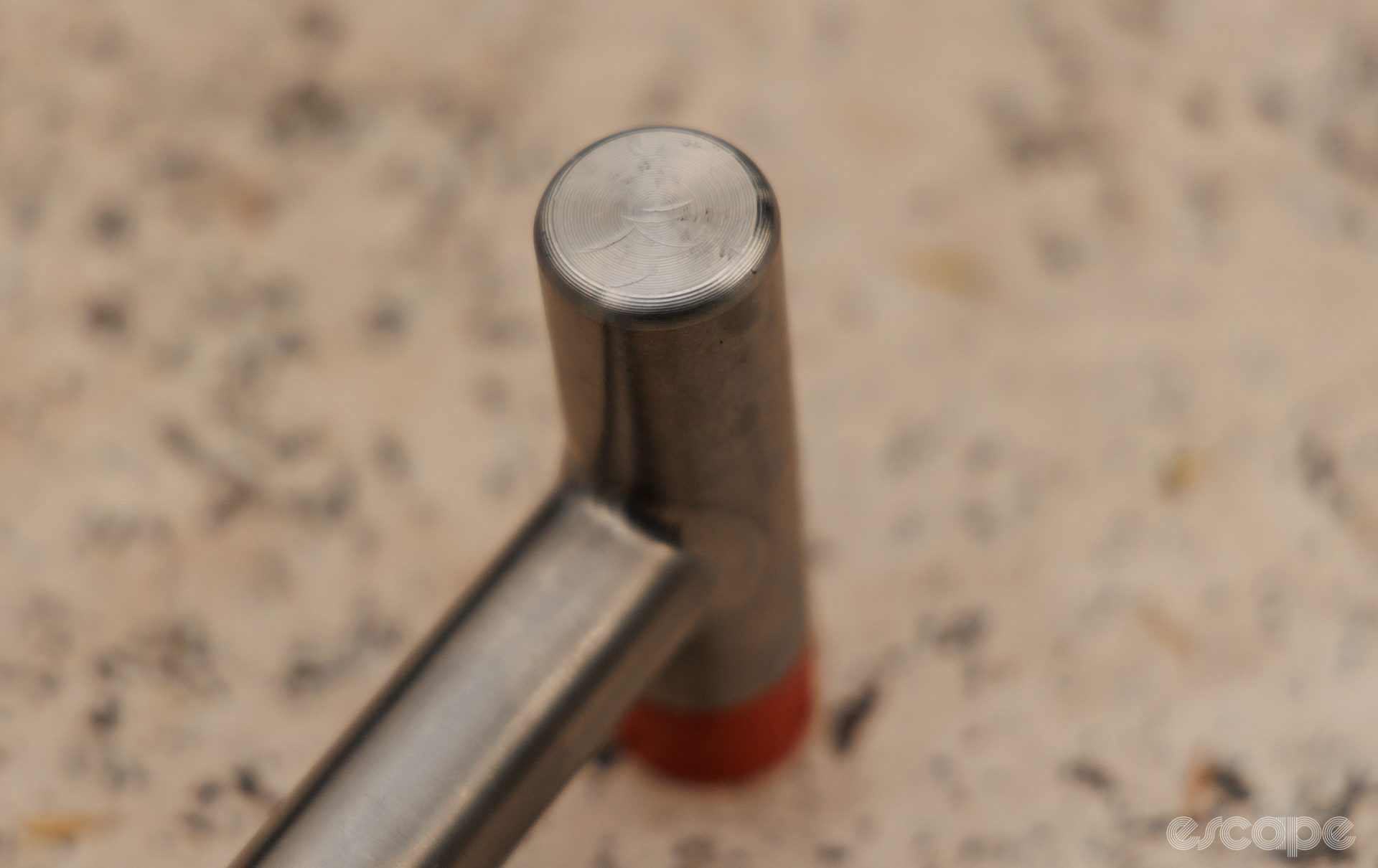 A close up showing the machined titanium face of the Rollingdale hammer. 