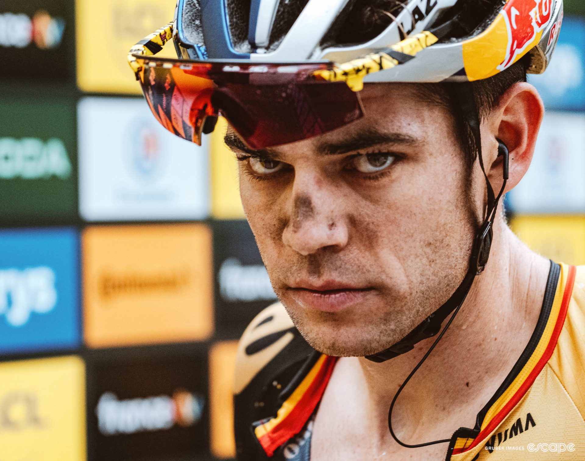 Wout van Aert stares intensely down the barrel of a camera. 