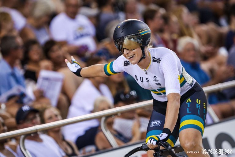 Nettie Edmondson salutes to the crowd in a track race while wearing the Australian colours.