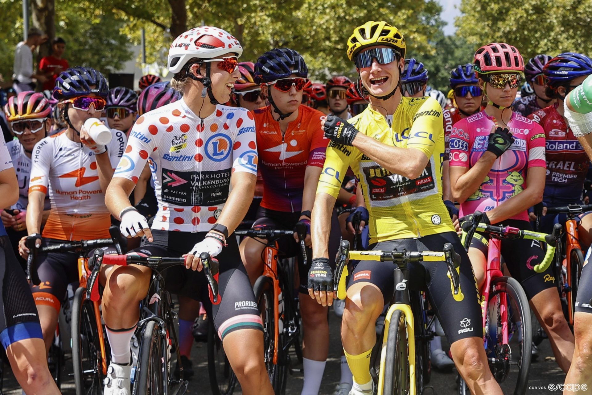 Femke Gerritse jokes with Marianne Vos on the start line of the seventh stage of the 2022 Tour de France Femmes. 