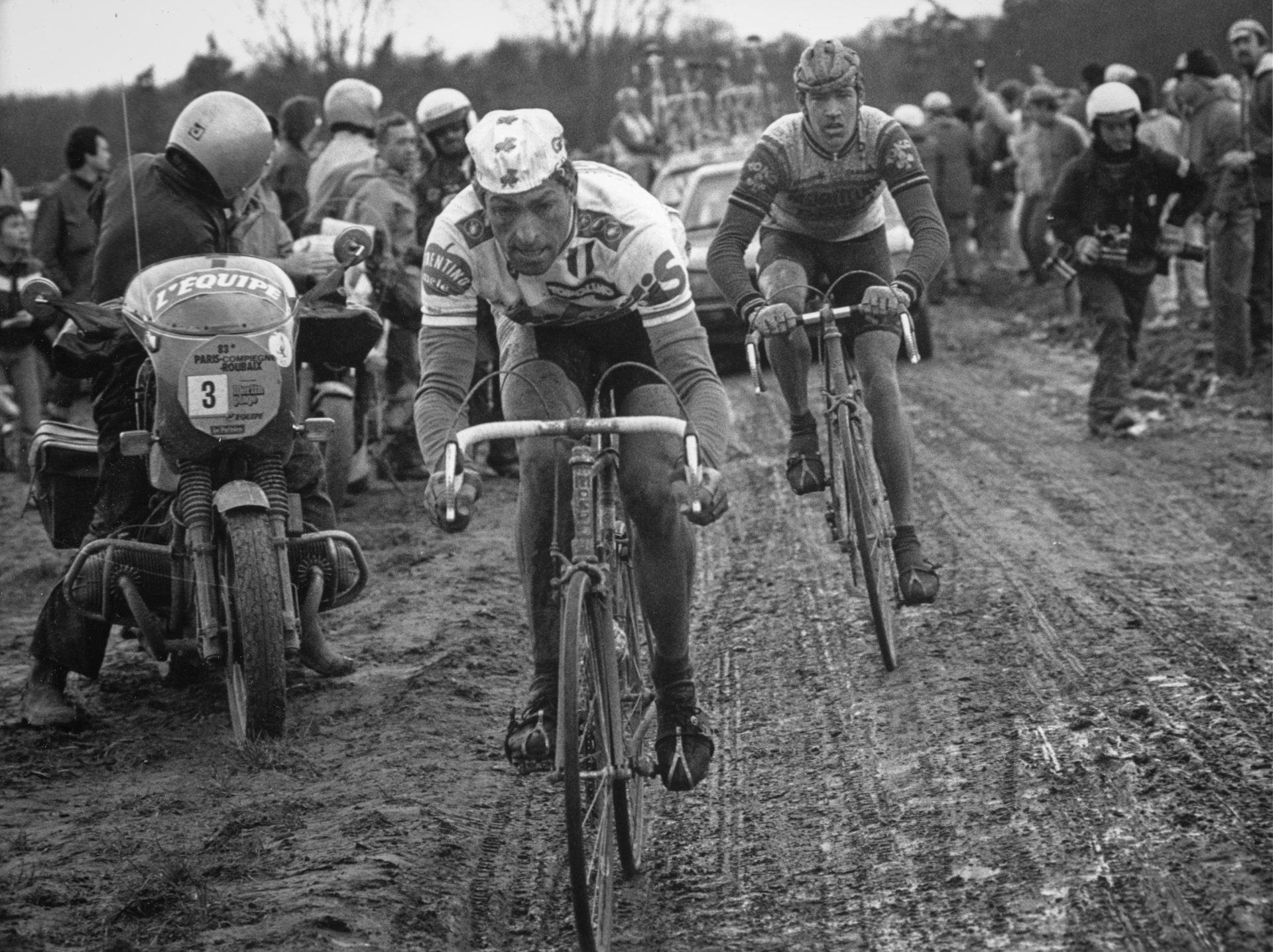 Sean Kelly rides in a historical, muddy, edition of Paris-Roubaix.