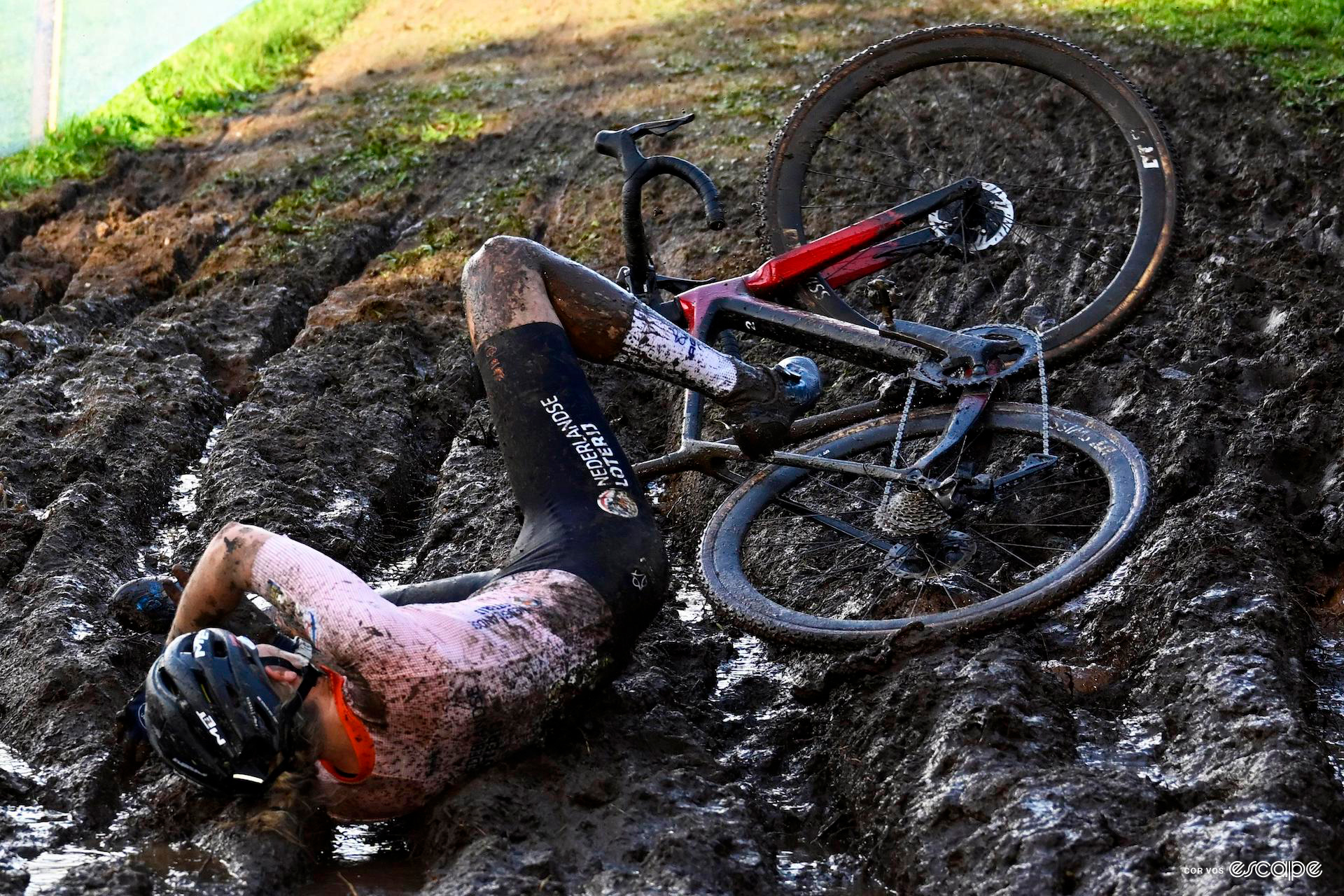 Aniek van Alphen lies on her side after slipping in in the deep mud during the european cx champs.